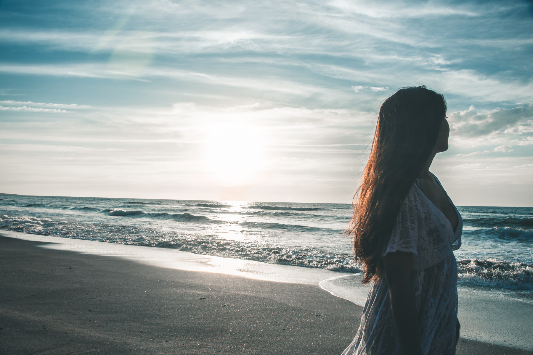 Woman Walking By The Seashore